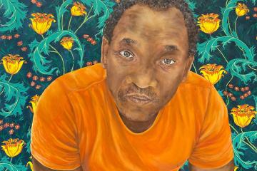 A painting of a man looking directly at the audience, against a vibrant patterned background, wearing a bright orange t-shirt.