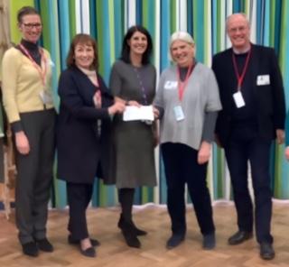 Susan Rumsey, our Chairman, presenting a cheque for £1500 to Rachel Hargreaves, Executive Head Mowbray School, and Yvonne Nicholson, Chairman We Can Dance.