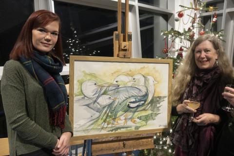 Felicitas Wagner  and Lesley Ann Price admire "Feathered Fight"